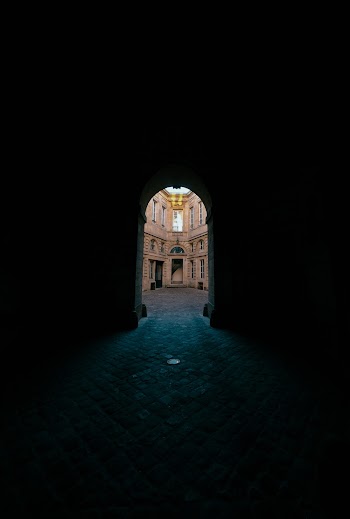 Archway To A Brown Concrete Building