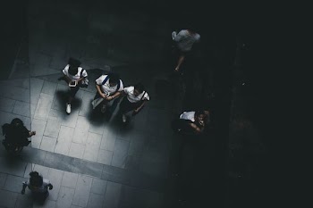 areal view photography of three person walking on road