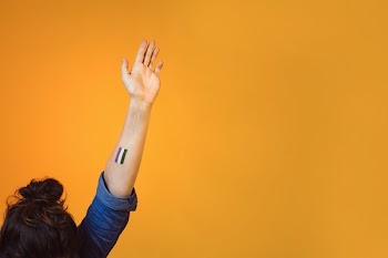 Arm Waving With Genderqueer Flag