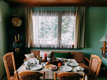 Arranged Table With Chairs and Plates Near Window