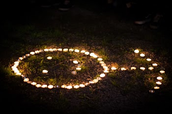 Arrow Shaped Lighted Tealight Candles on Grass