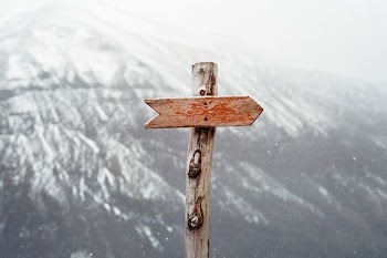 arrow sign on mountain
