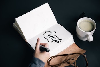 Artist Writing In Journal