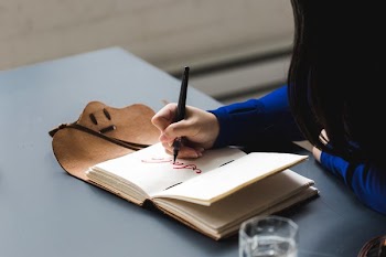 Artist Writing Sale In Notebook