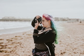 Artsy woman taking a photo | Free Photo - rawpixel