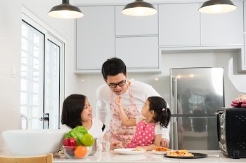 asian family cooking at kitchen  
