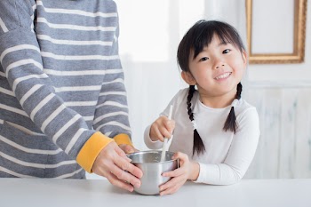 asian family enjoy cooking at home