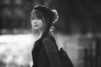 Asian woman looking back in black and white