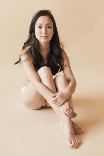 Asian young woman in underwear sitting with legs crossed Free Photo