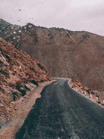 Asphalt Road Beside Rock Formation