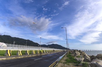 Asphalt Road Near Body Of Water