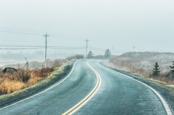 Asphalt Road Near Power Poles