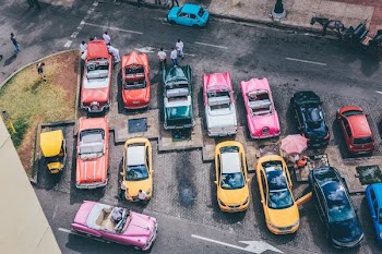 assorted cars parked during daytime
