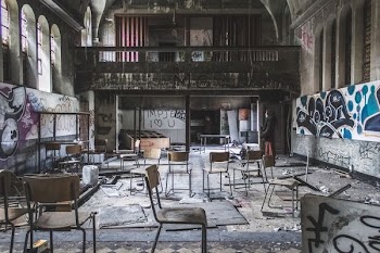 assorted chains on abandoned room with graffiti