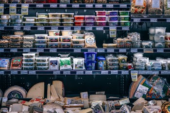 Assorted Cheese On Grocery Shelves