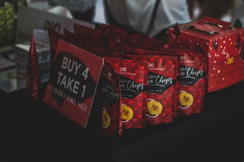 Assorted Chip Packs on Black Surface in Tilt Shift Photography