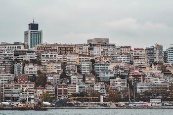 assorted-color buildings near body of water
