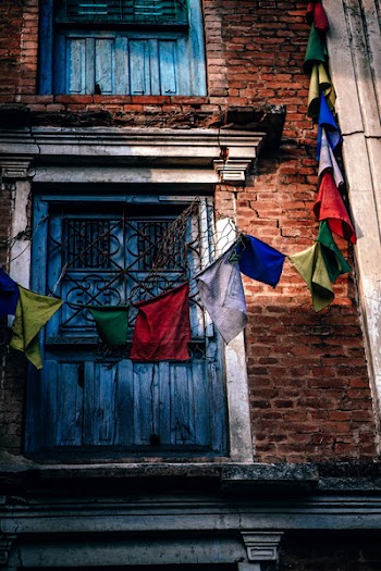 Assorted-color Buntings in Front of Building