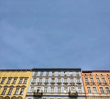 Assorted-color Commercial Buildings Under Cloudy Sky