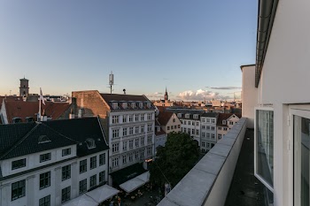 Assorted-color Concrete Buildings Under Blue Sky