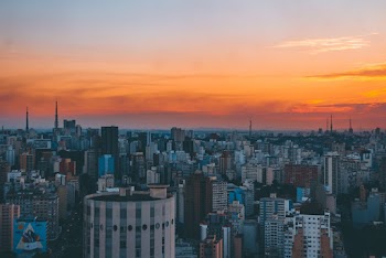Assorted-color Concrete Buildings Under Cloudy Sky