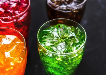 Assorted-color Drinks on Black Surface