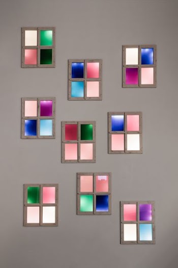 assorted-color photo frames hanging on wall