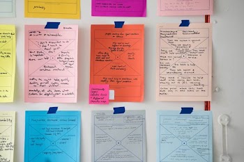 assorted-color printer paper in wall