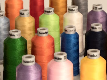 Assorted-color Threads on White Surface