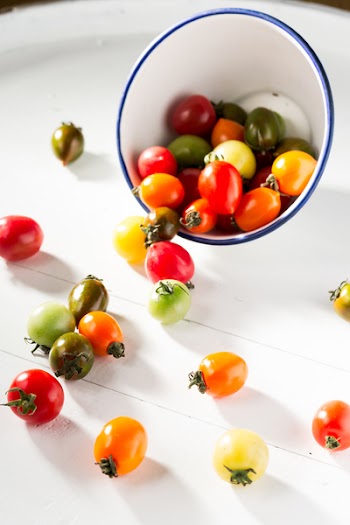 Assorted-color Tomatoes in White Bowl and on White Surface