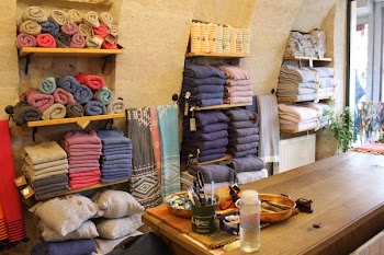 Assorted-color Towels on Wooden Rack