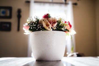 Assorted Flowers in White Ceramic Vase