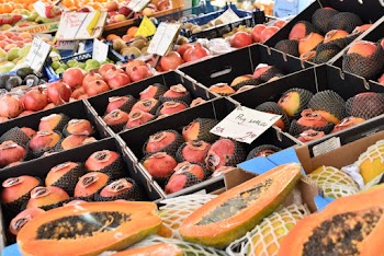 Assorted Fruits on Display Near Papaya Fruits