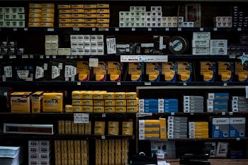 assorted-labeled pack lot in shelf