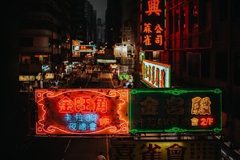 assorted lit kanji script LED signages on buildings during nighttime