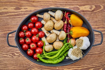 Assorted Spices in Casserole on Brown Wooden Table