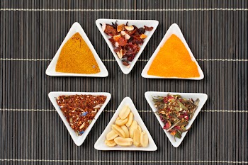Assortment of spices for prepare tasty food over a bamboo mat