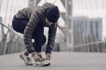 Athlete Tying Running Shoes