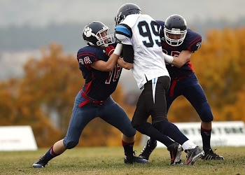 Athletes With Ball on the Background