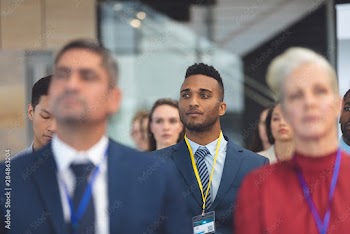 Attentive young businessman in a business seminar