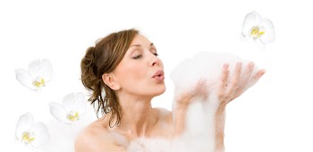 Attractive woman enjoys  in the bathtub