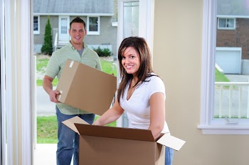 Attractive Young Couple Moving Into A New House