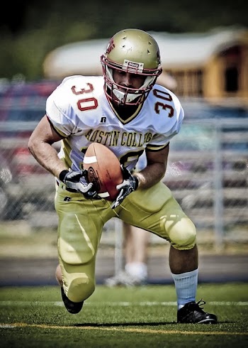 Austin College Football Player Running With Football