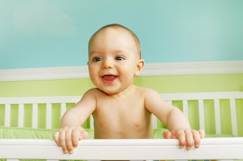 Baby Boy Smiling in crib