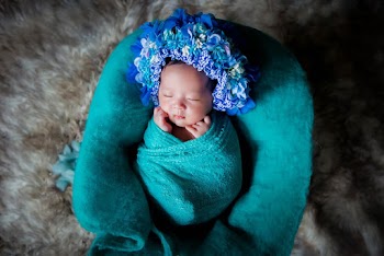 Baby Covered by Blue Blanket