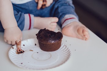 Baby eating a muffin