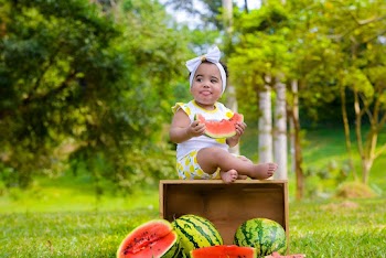 Baby Holding Watermelon Slice