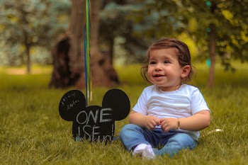 Baby Sitting on Lawn Grass