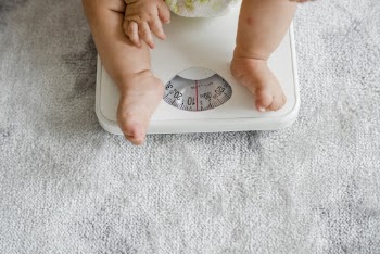 Baby Sitting On Scale