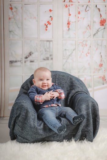 Baby Sitting on Sofa Chair